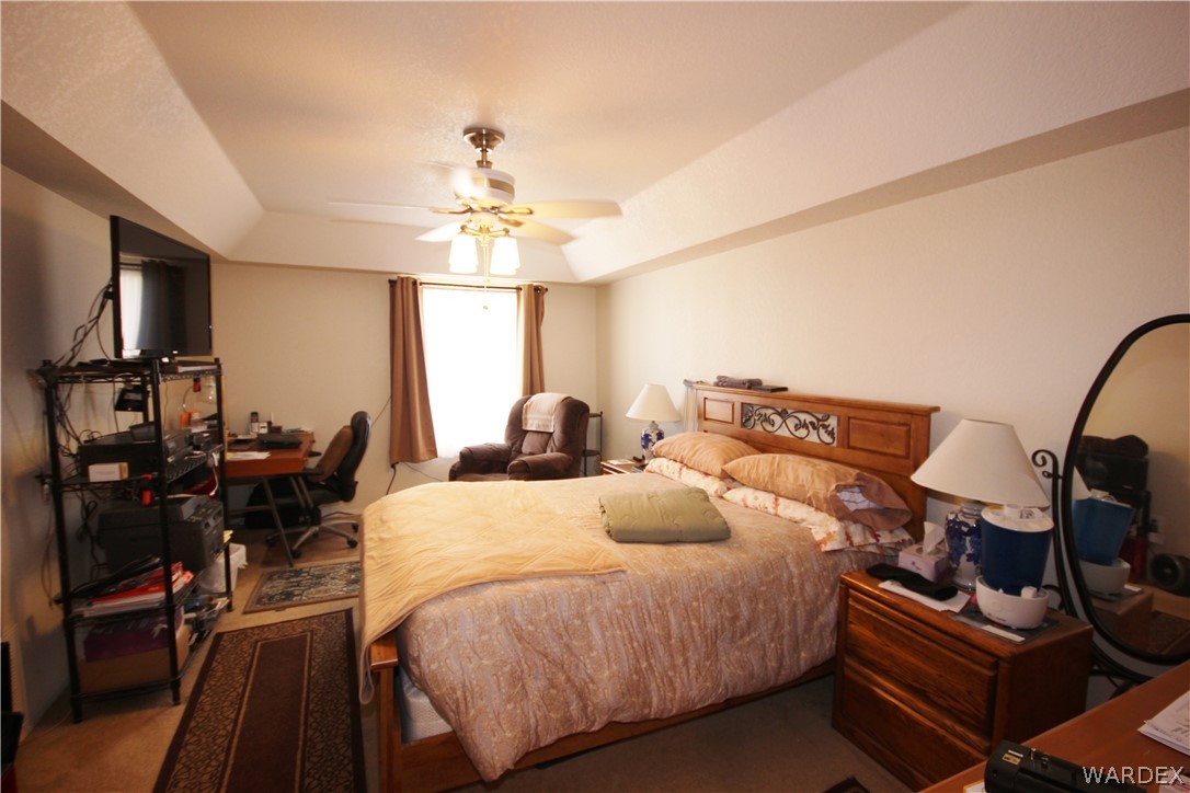 3408 Sunriver Road, Unit 109 Bullhead City, AZ 86429 - Photo 9 of 23 a bedroom with bed and window