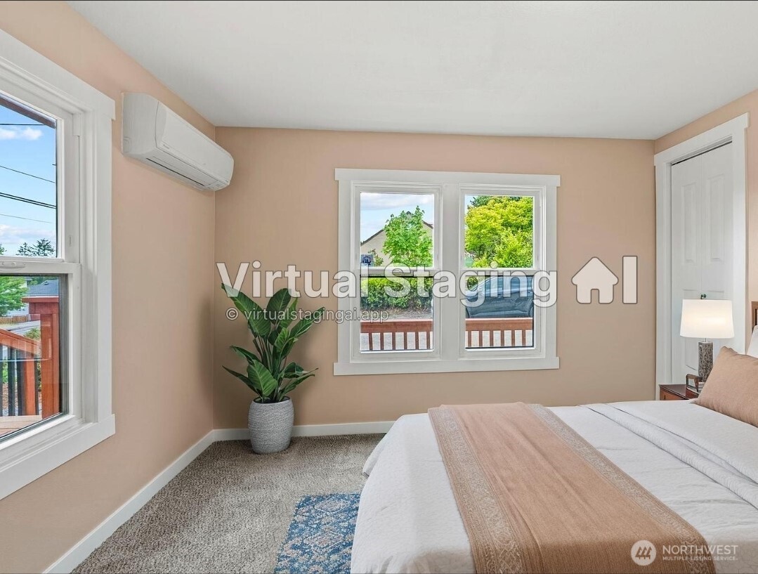 2914 Columbia Heights Road Longview, WA 98632 - Photo 13 of 29 a bedroom with a bed and a potted plant
