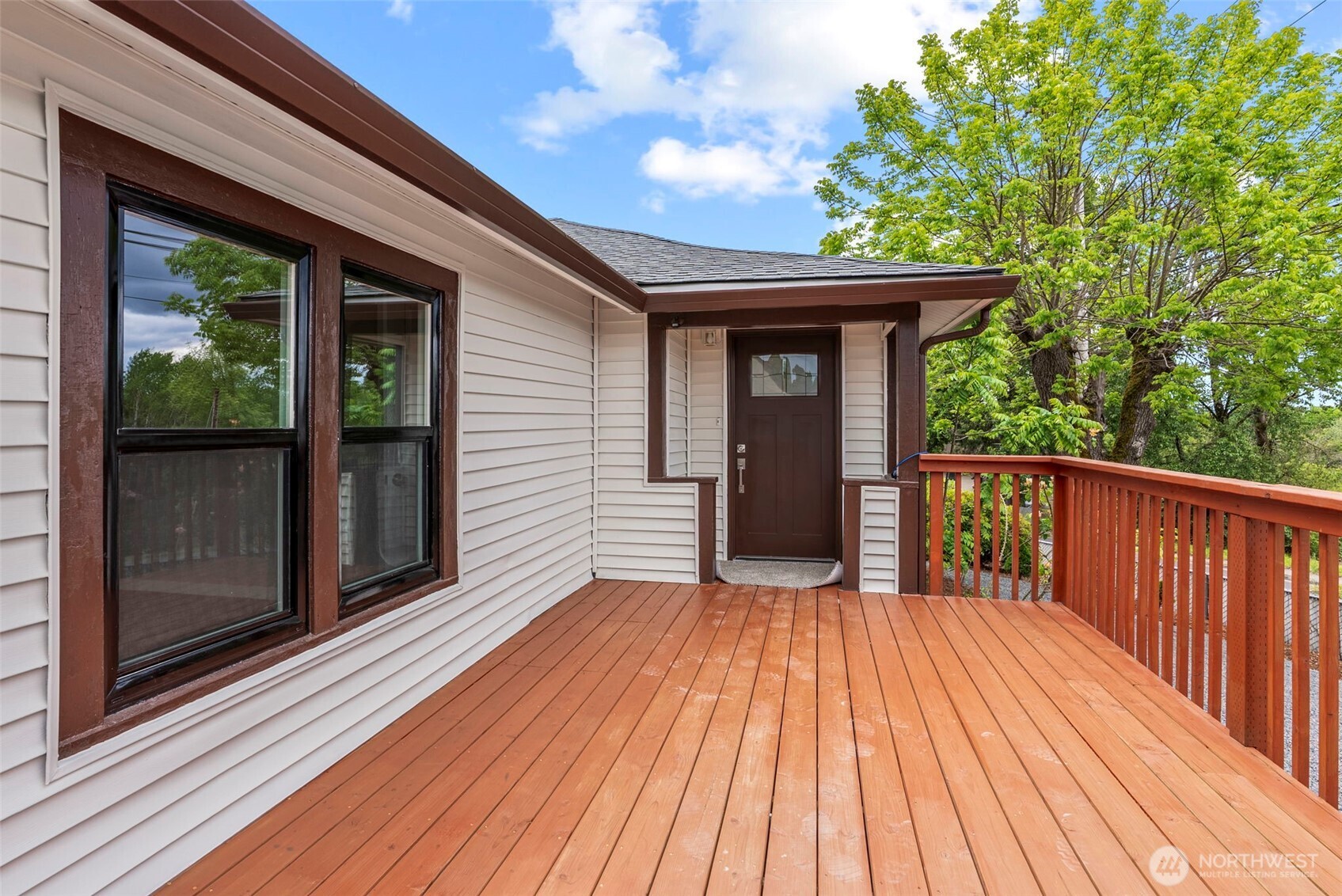 2914 Columbia Heights Road Longview, WA 98632 - Photo 2 of 29 a view of backyard with a deck and wooden floor