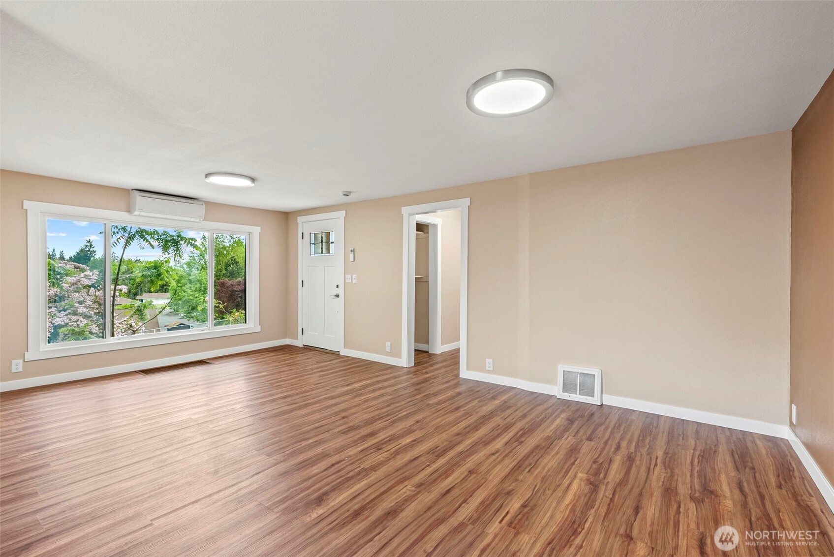 2914 Columbia Heights Road Longview, WA 98632 - Photo 4 of 29 a view of an empty room with wooden floor and a window