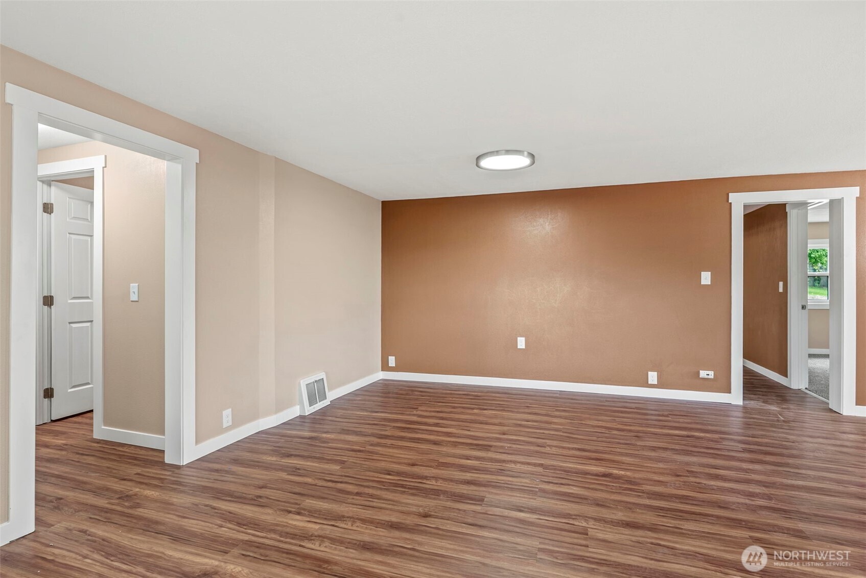 2914 Columbia Heights Road Longview, WA 98632 - Photo 6 of 29 a view of an empty room with wooden floor