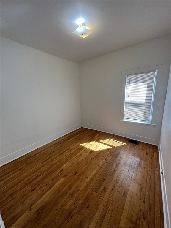 148 5th Street, Unit 2 Cambridge, MA 02141 - Photo 6 of 14 a view of empty room with wooden floor and fan