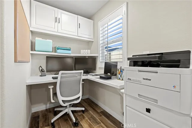a bedroom with bed and a chandelier