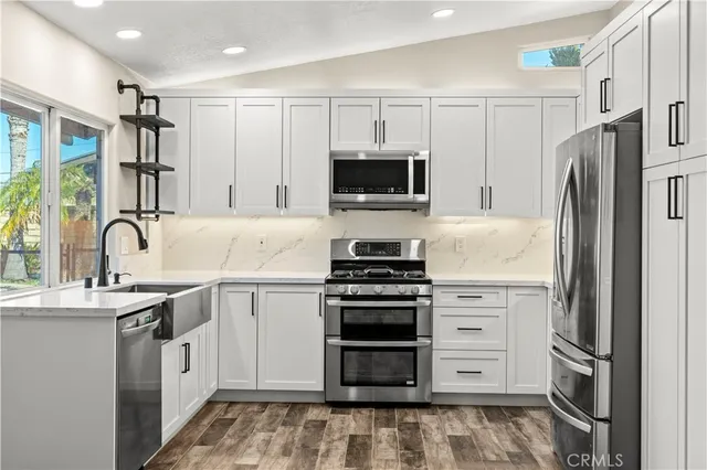 a bedroom with a bed and a table in it