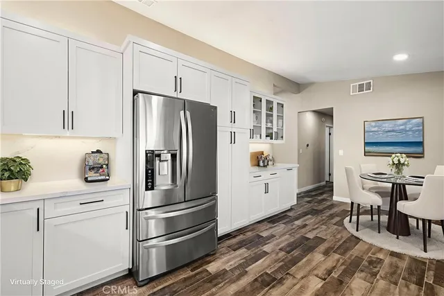 a bedroom with bed and a chandelier