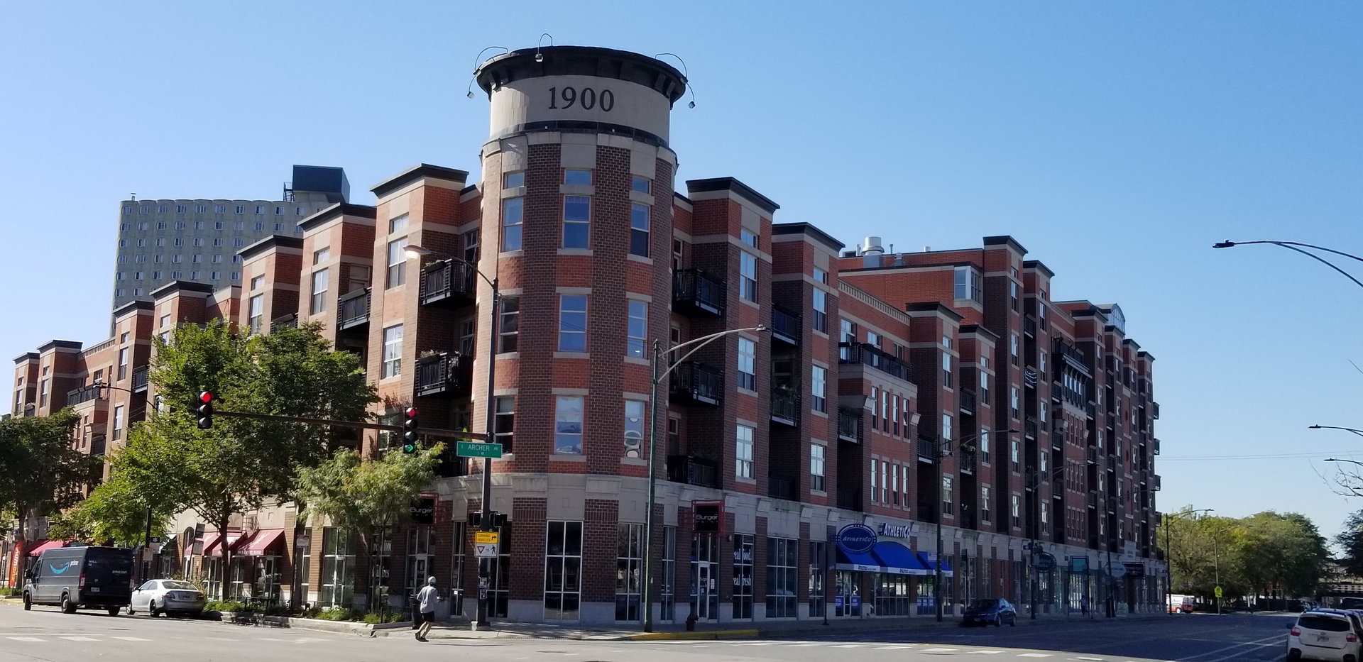 1910 South State Street, Unit 301 Chicago, IL 60616 - Photo 1 of 12 a front view of a building with lot of trees and plants