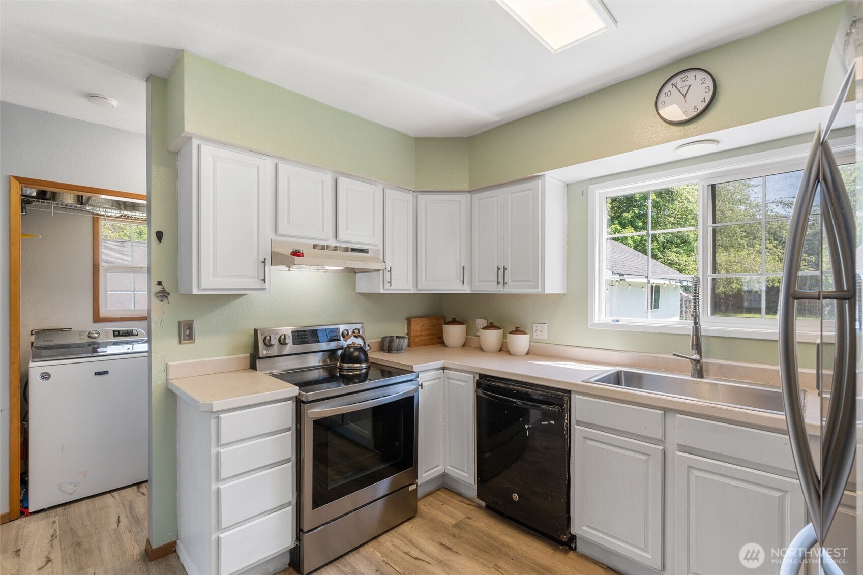 226 Southwest 16th Street Chehalis, WA 98532 - Photo 11 of 38 a kitchen with a sink stove top oven and cabinets