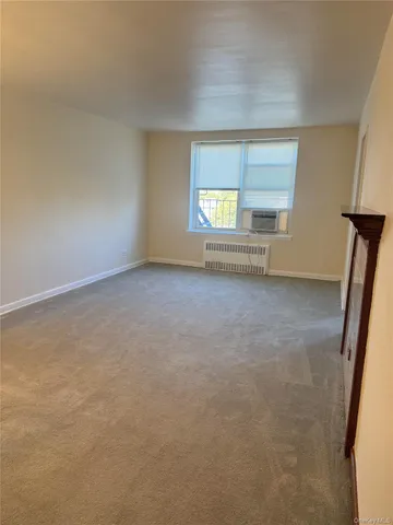 a view of a room with window and stairs