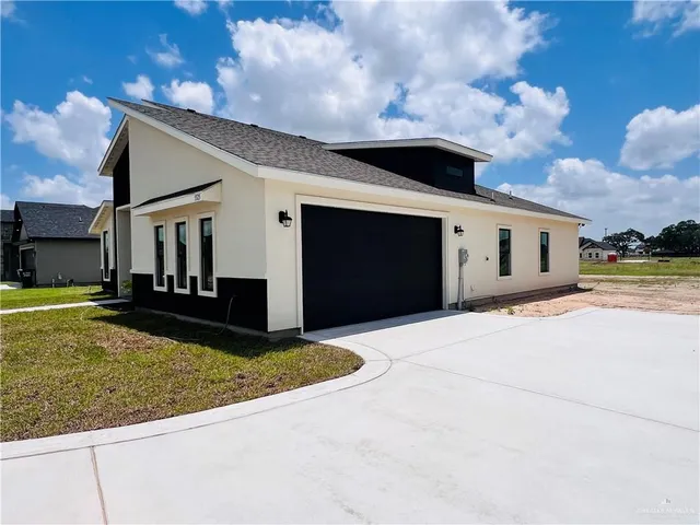 a front view of house with yard