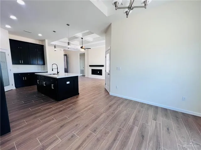a spacious bathroom with a sink and mirror
