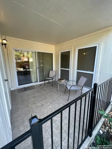 a view of a living room and balcony