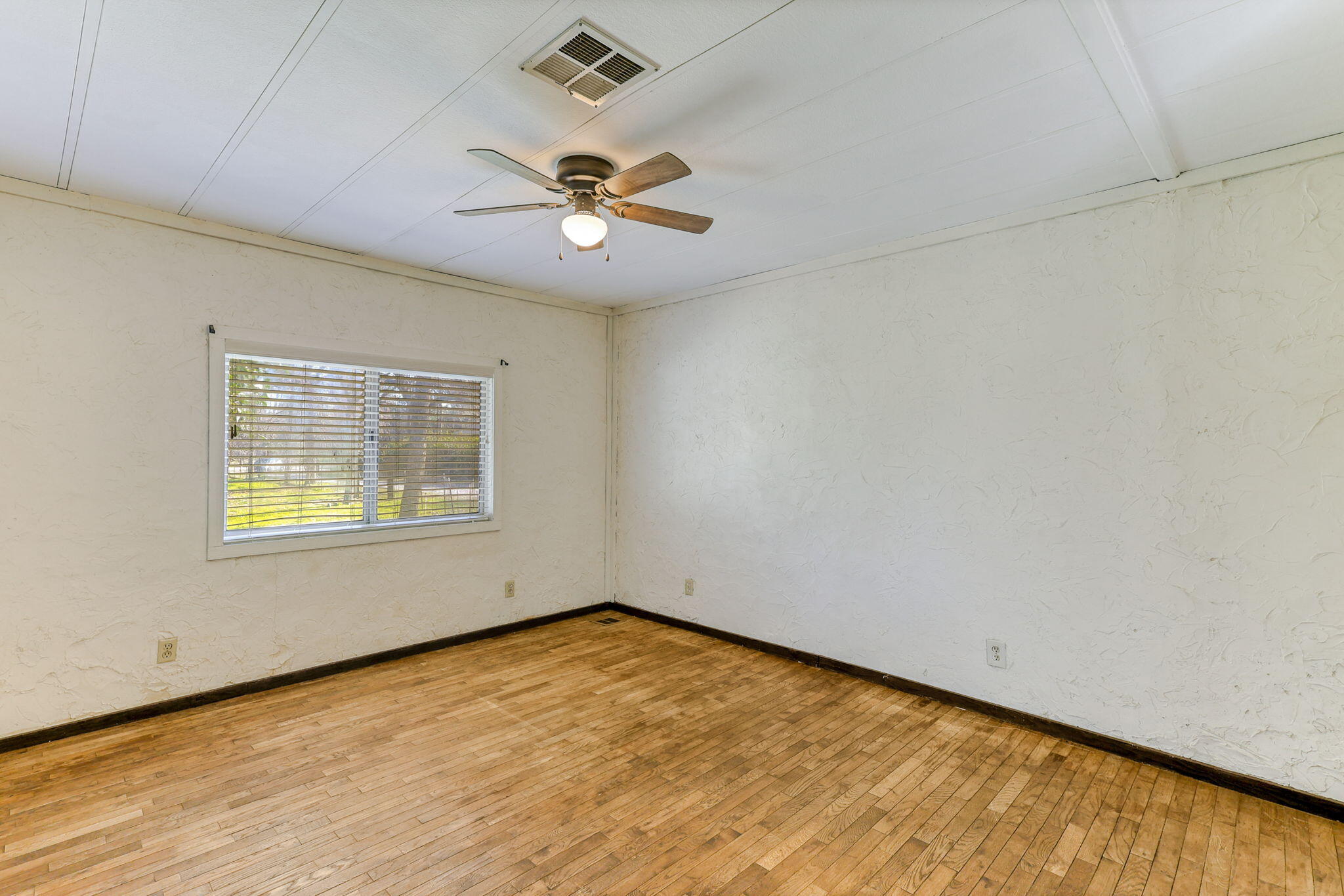 5082 Happy Valley Road Anderson, CA 96007 - Photo 24 of 66 a view of an empty room with a window