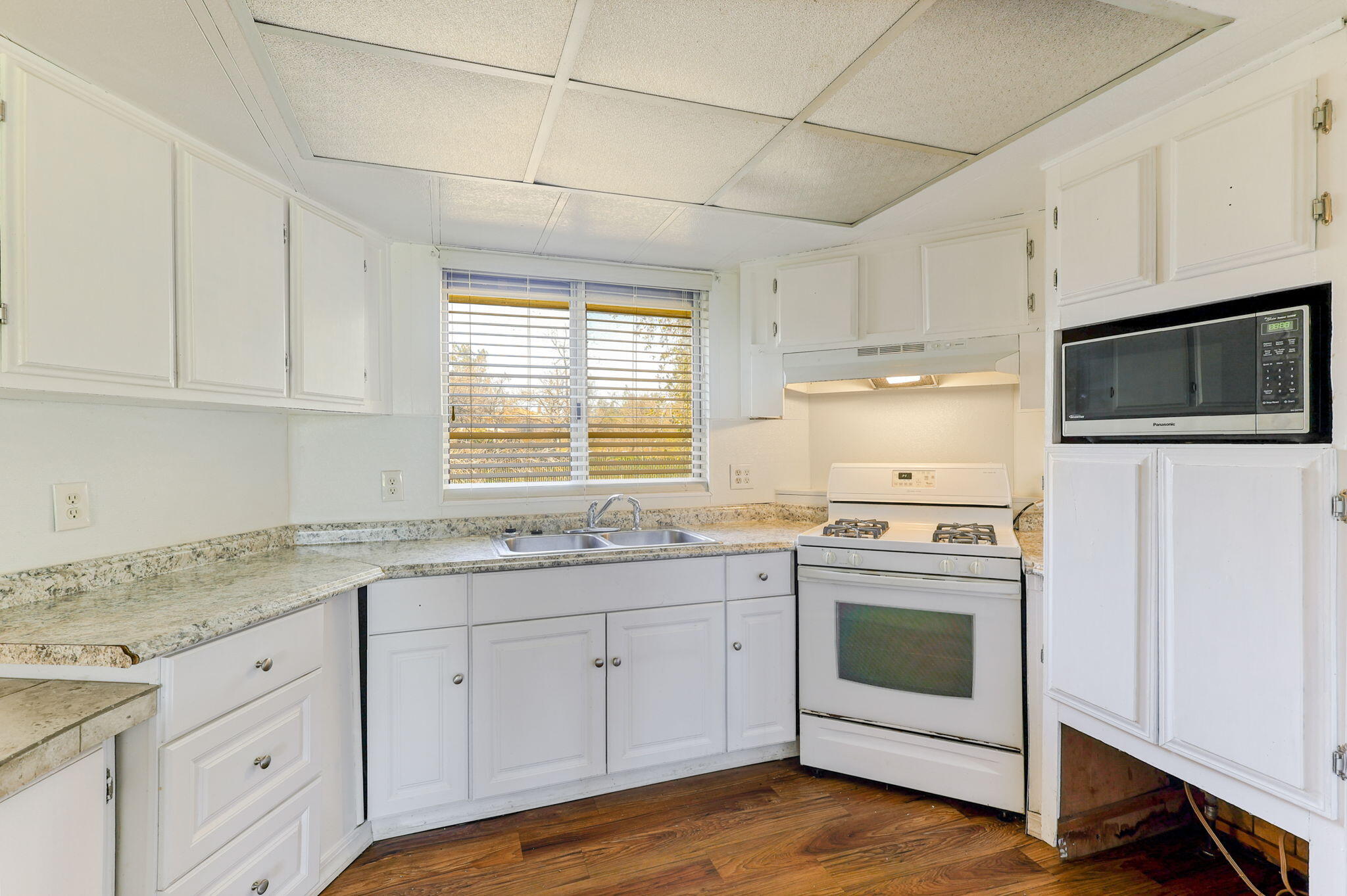 5082 Happy Valley Road Anderson, CA 96007 - Photo 3 of 66 a kitchen with granite countertop cabinets stainless steel appliances and a sink