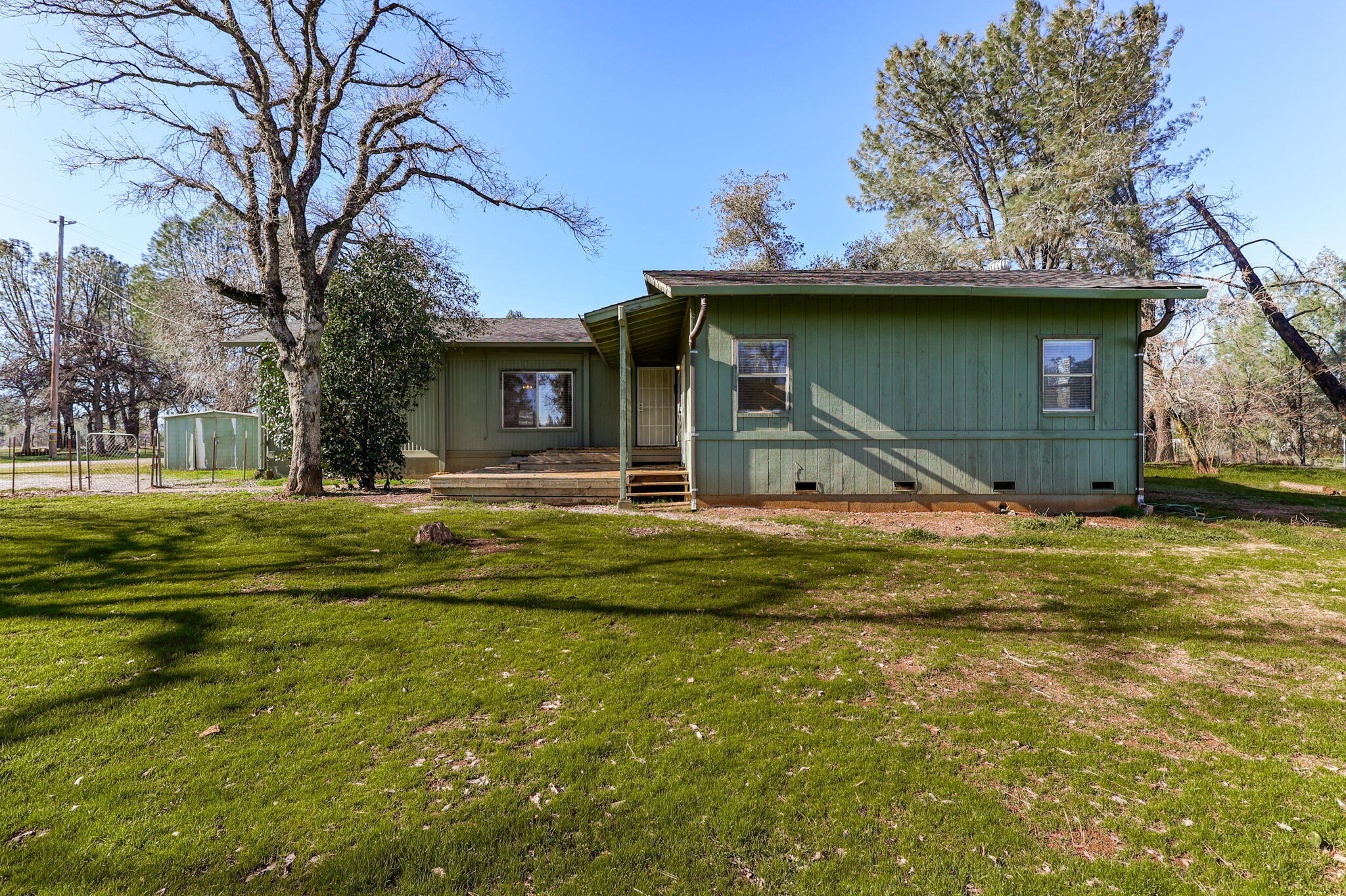 5082 Happy Valley Road Anderson, CA 96007 - Photo 32 of 66 a house view with a swimming pool