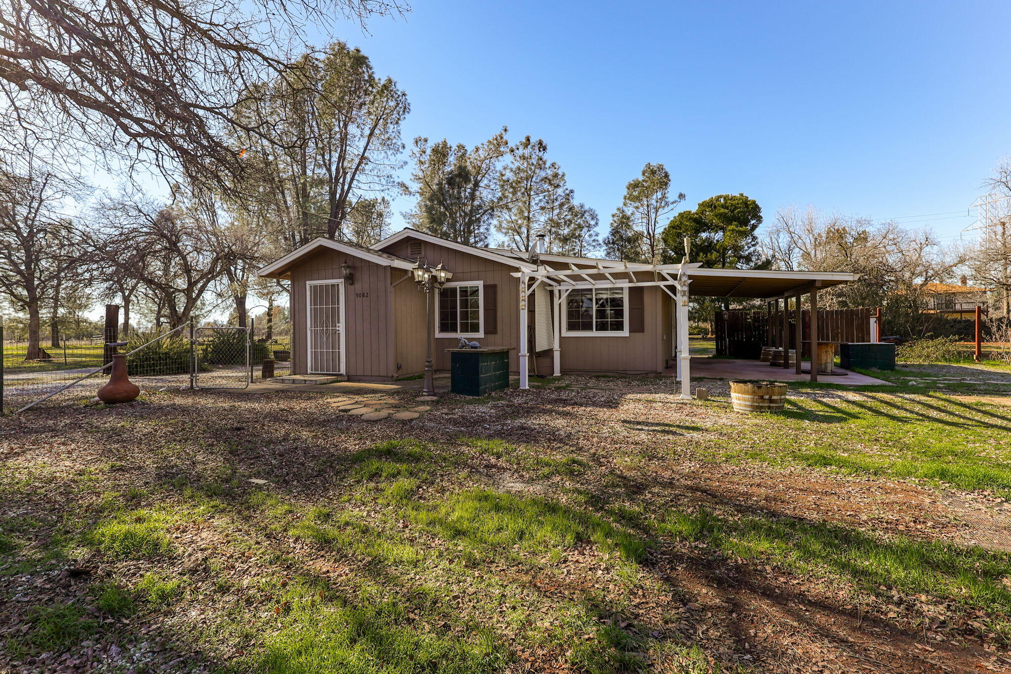 5082 Happy Valley Road Anderson, CA 96007 - Photo 36 of 66 a front view of a house with garden