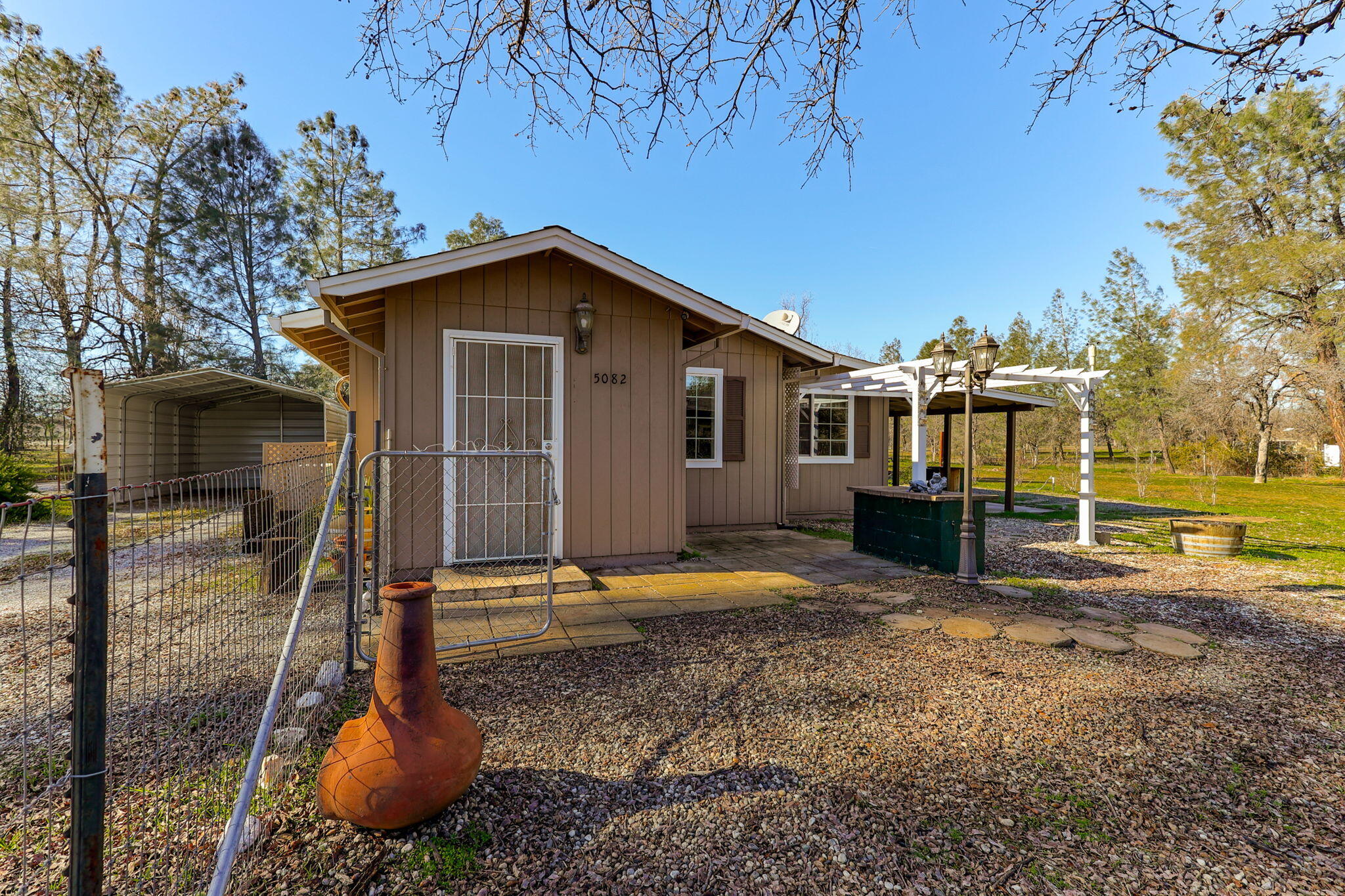 5082 Happy Valley Road Anderson, CA 96007 - Photo 37 of 66 a view of a house with backyard and trees