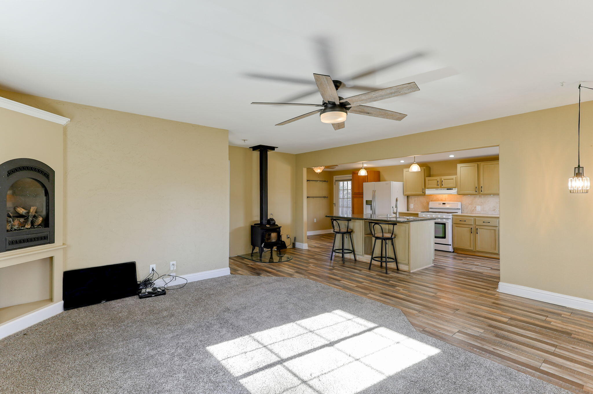 5082 Happy Valley Road Anderson, CA 96007 - Photo 40 of 66 a living room with furniture a dining table and kitchen view