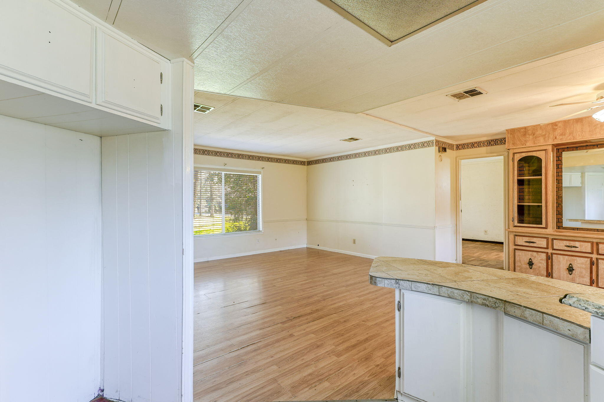 5082 Happy Valley Road Anderson, CA 96007 - Photo 4 of 66 a view of a kitchen cabinets a sink and wooden floor