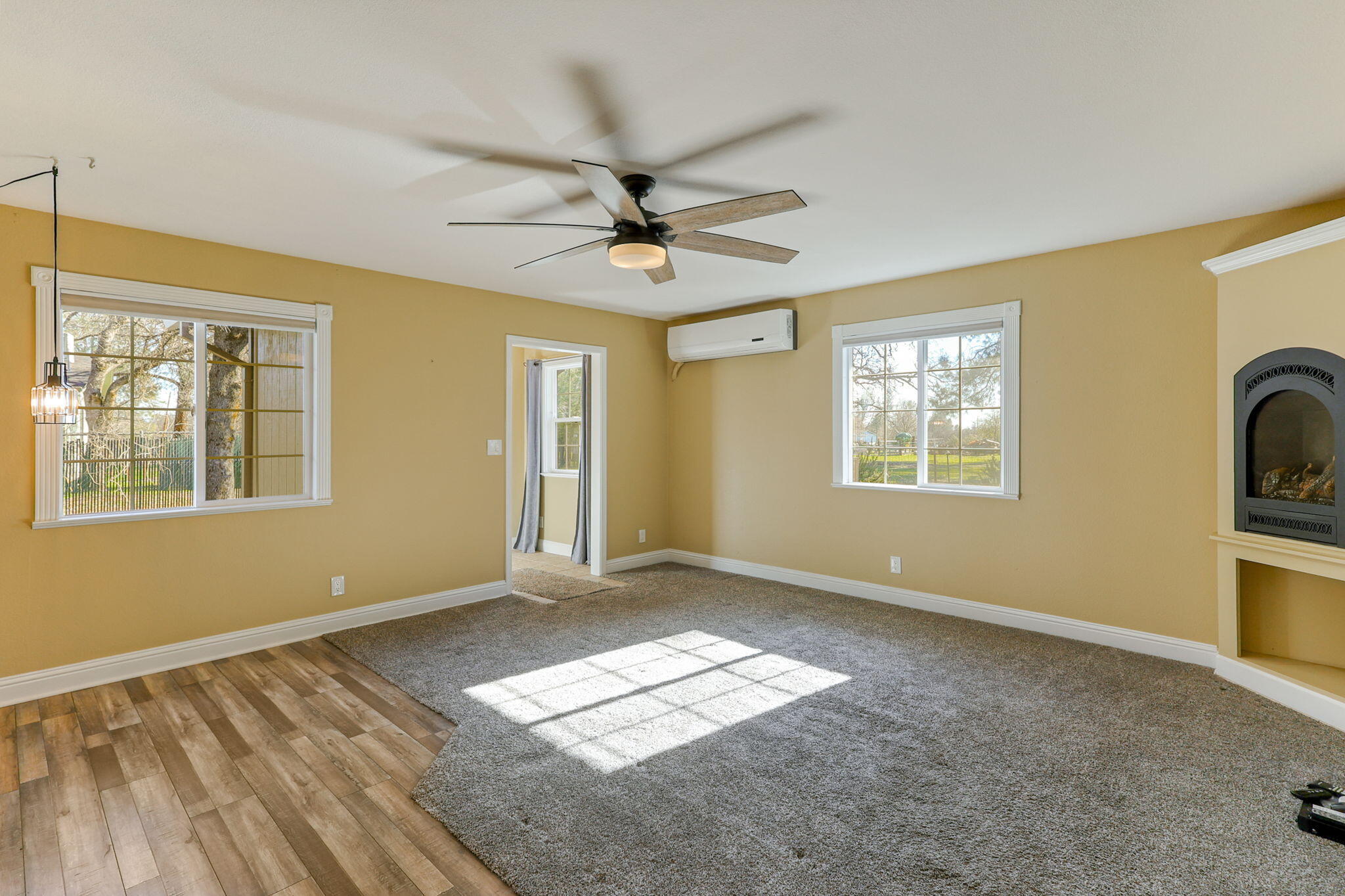 5082 Happy Valley Road Anderson, CA 96007 - Photo 46 of 66 a view of empty room with a window and fireplace