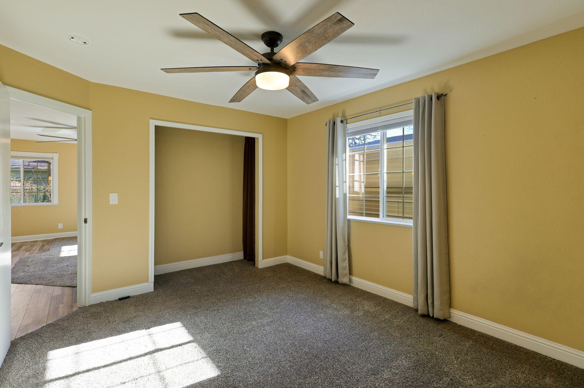 5082 Happy Valley Road Anderson, CA 96007 - Photo 55 of 66 a view of livingroom with hardwood floor and a ceiling fan