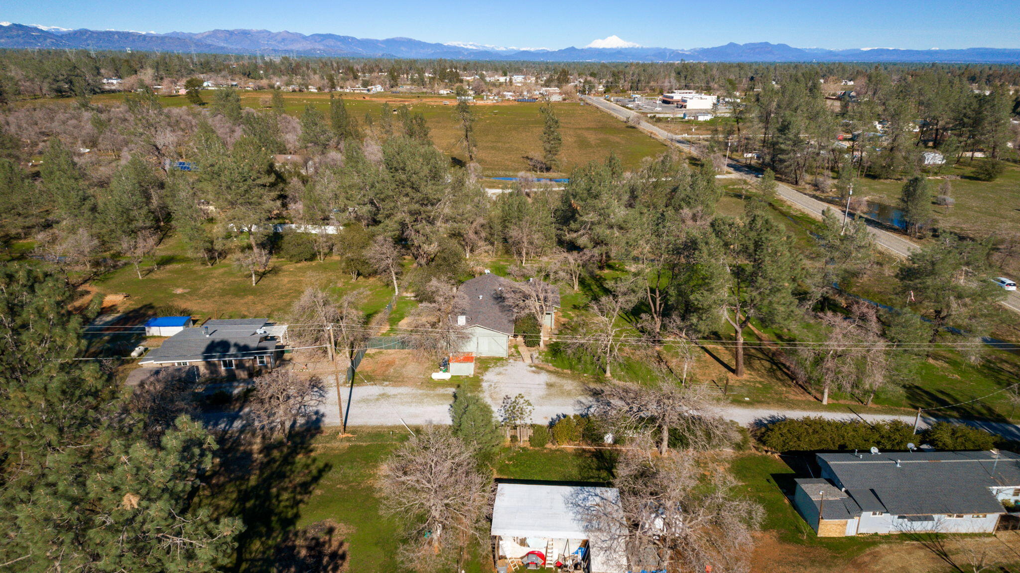 5082 Happy Valley Road Anderson, CA 96007 - Photo 65 of 66 an aerial view of residential building with outdoor space and trees