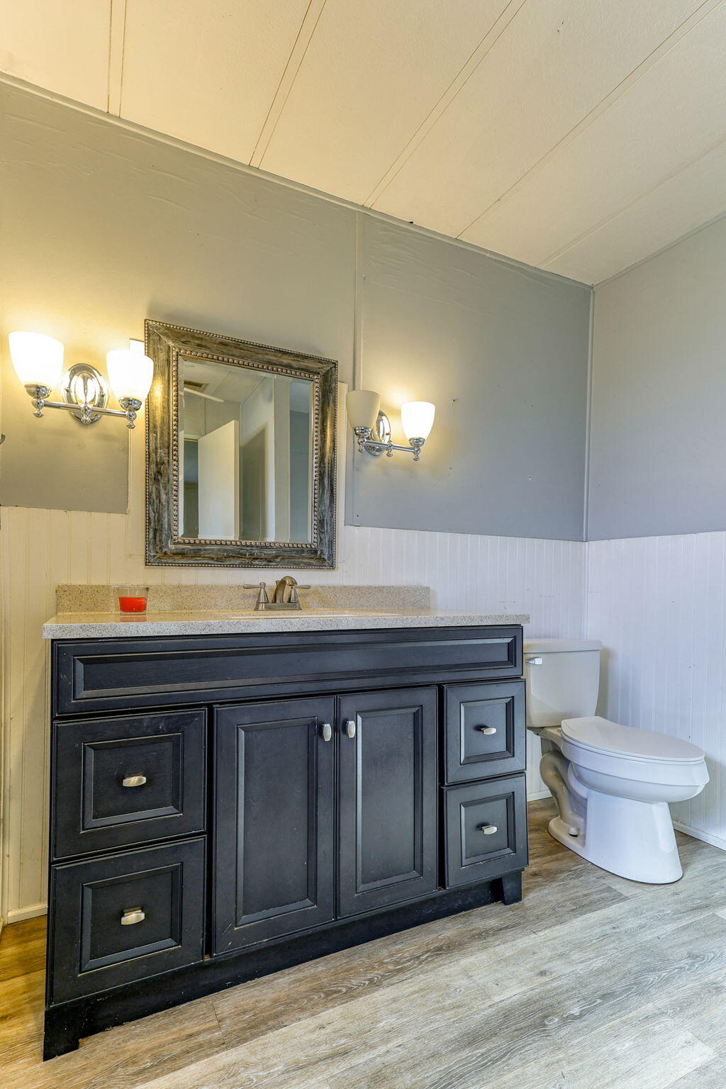 5082 Happy Valley Road Anderson, CA 96007 - Photo 8 of 66 a bathroom with a toilet sink and mirror
