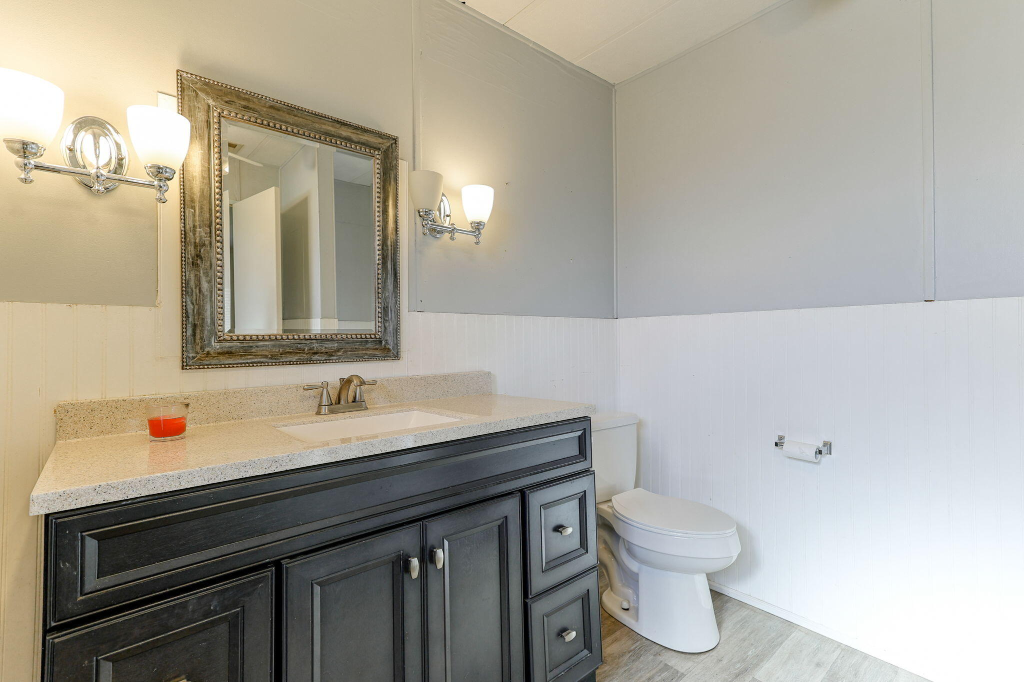 5082 Happy Valley Road Anderson, CA 96007 - Photo 10 of 66 a bathroom with a sink a toilet and mirror