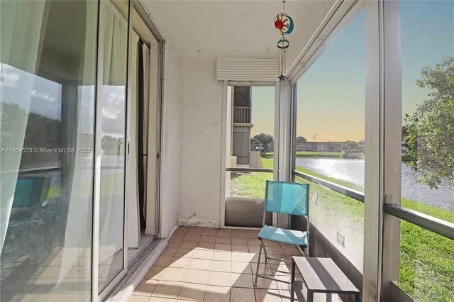 a view of a balcony with wooden floor