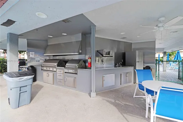 a kitchen with sink cabinets and window
