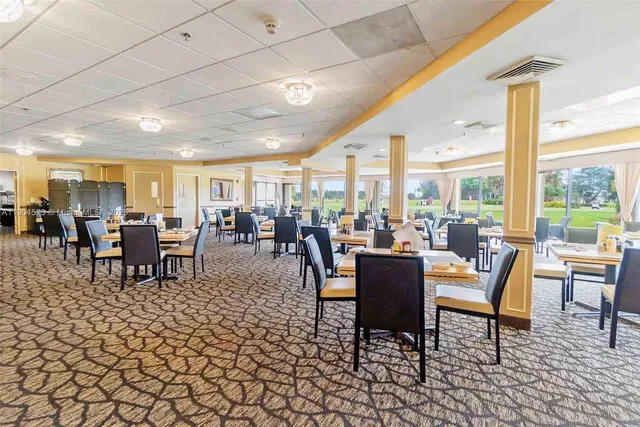 a dining room with lots of tables and chairs