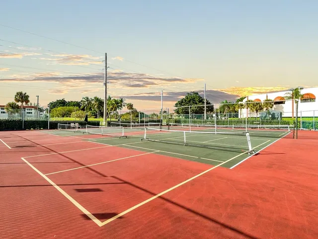 a view of an outdoor space and tennis court