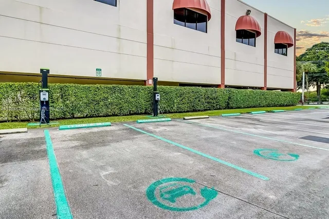 a view of a backyard with potted plants