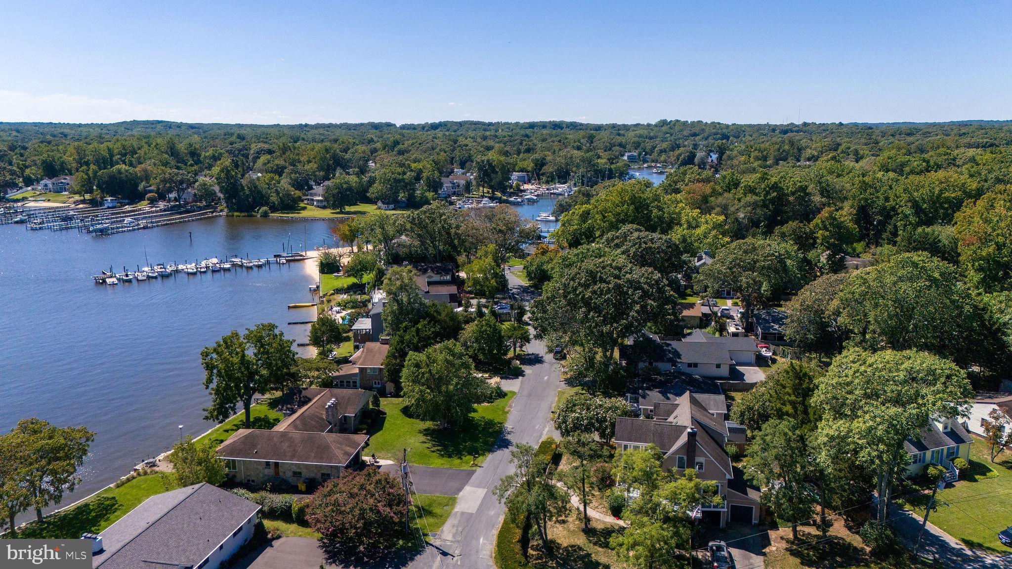 9 Beach Road Severna Park, MD 21146 - Photo 11 of 58 an aerial view of a houses with a yard and lake view
