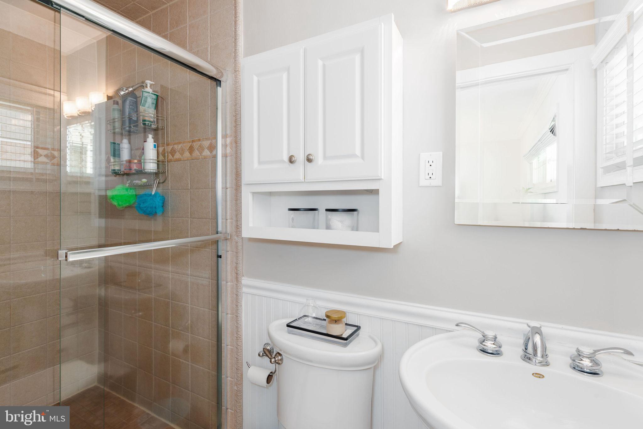 9 Beach Road Severna Park, MD 21146 - Photo 38 of 58 a bathroom with a sink and a mirror