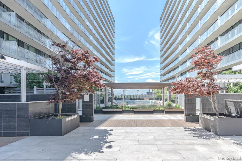 131-05 40 Road, Unit 18H Queens, NY 11354 - Photo 3 of 14 a view of a building with a tree