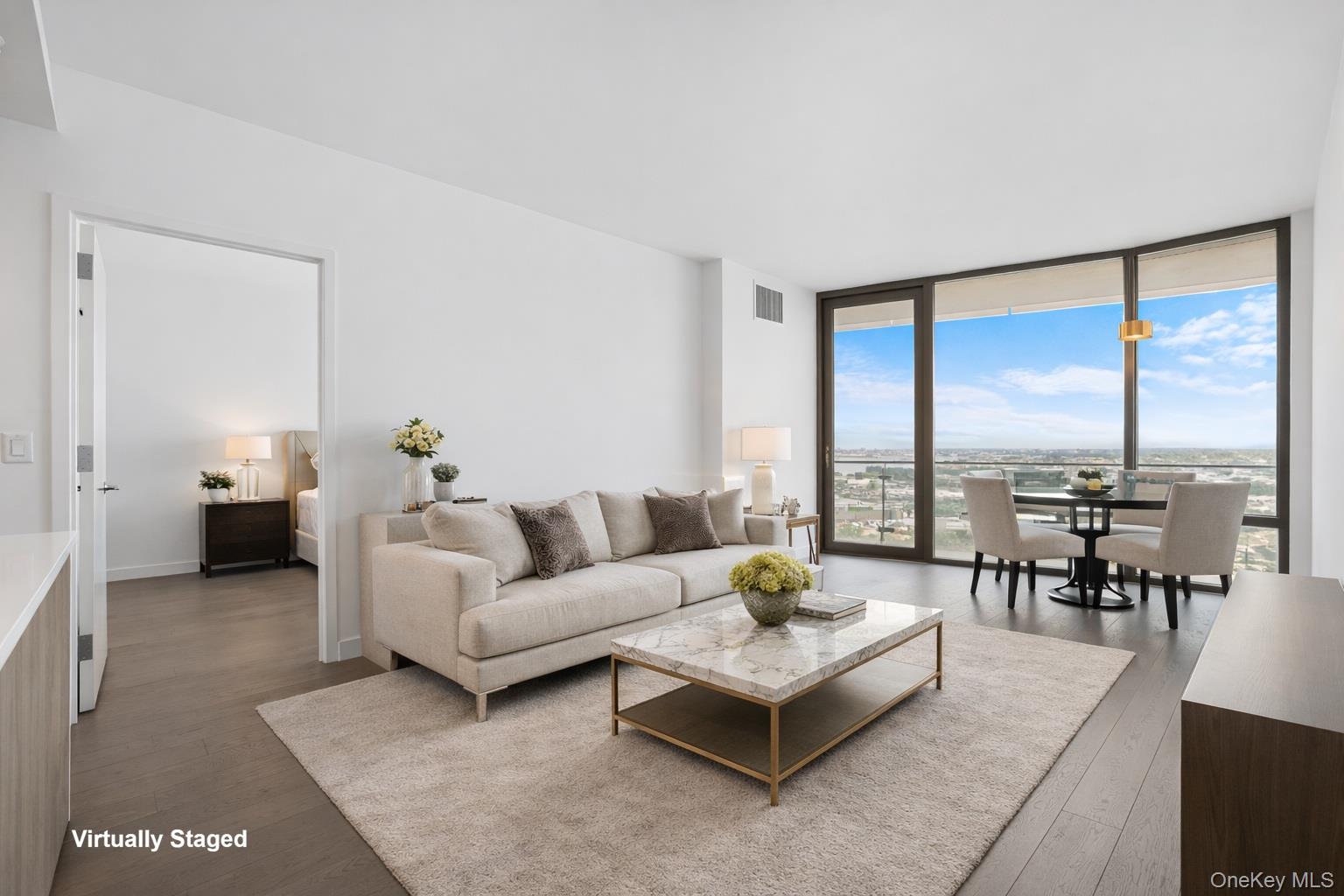 131-05 40 Road, Unit 18H Queens, NY 11354 - Photo 9 of 14 a living room with furniture and floor to ceiling windows