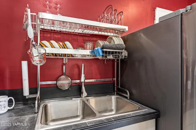 a room with furniture a washer and dryer
