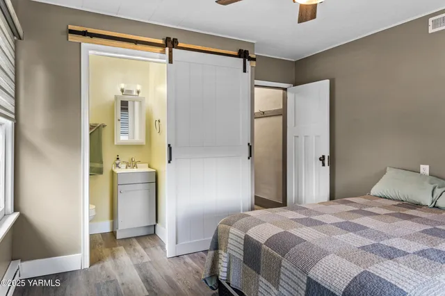 a bedroom with a large bed and a window