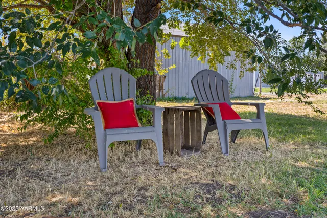 a view of a wooden fence and a floor to ceiling window