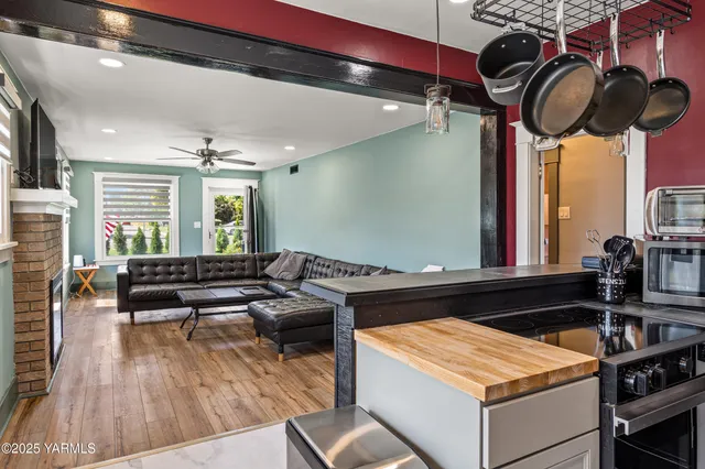 a kitchen with stainless steel appliances granite countertop a stove and a sink