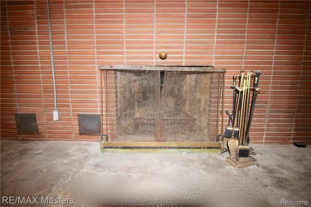 2070 North Raisinville Road Monroe, MI 48162 - Photo 20 of 25 BASEMENT FIREPLACE