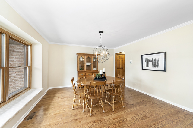 1940 Slippery Rock Road Naperville, IL 60565 - Photo 2 of 28 a dining room with furniture window and wooden floor
