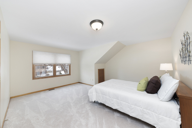 1940 Slippery Rock Road Naperville, IL 60565 - Photo 16 of 28 a bedroom with a bed and a window