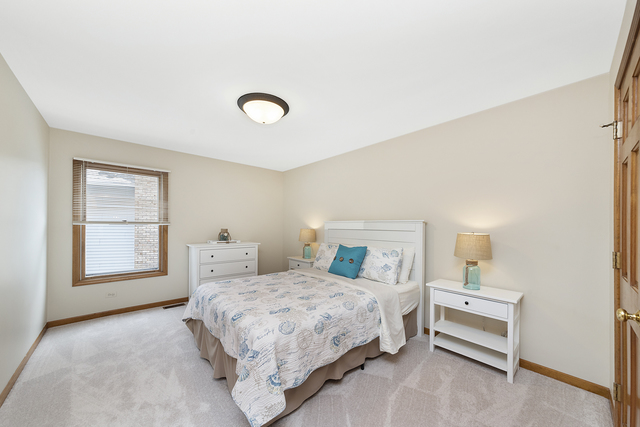 1940 Slippery Rock Road Naperville, IL 60565 - Photo 17 of 28 a bedroom with a bed and a window