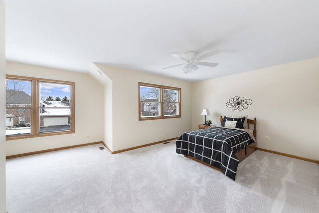 1940 Slippery Rock Road Naperville, IL 60565 - Photo 18 of 28 a living room with furniture a ceiling fan and a window