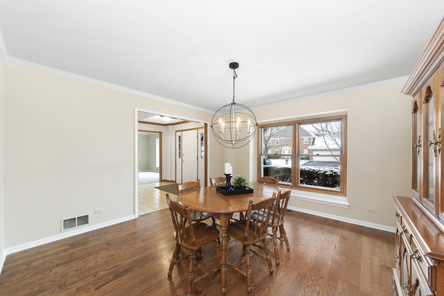 1940 Slippery Rock Road Naperville, IL 60565 - Photo 3 of 28 a view of a dining room with furniture window and wooden floor