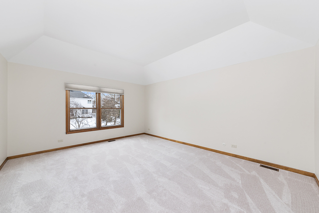 1940 Slippery Rock Road Naperville, IL 60565 - Photo 22 of 28 a view of an empty room with windows