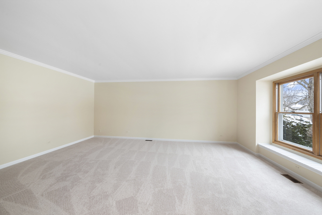 1940 Slippery Rock Road Naperville, IL 60565 - Photo 4 of 28 a view of an empty room with a window