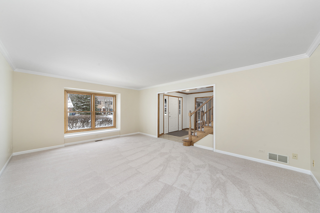 1940 Slippery Rock Road Naperville, IL 60565 - Photo 5 of 28 an empty room with windows and closet