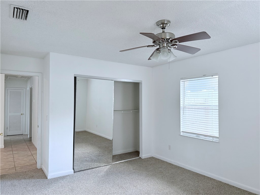 224 Georgia Street Vero Beach, FL 32962 - Photo 11 of 23 a view of a livingroom with a ceiling fan and window